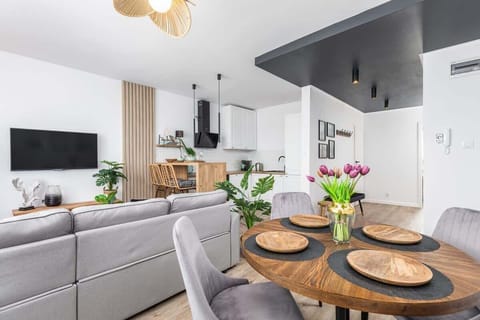 Large table with chairs for eating communal meals.