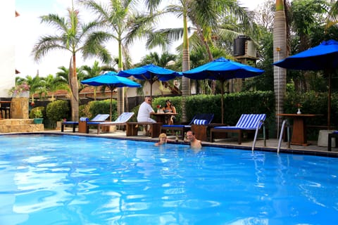 Outdoor pool, pool umbrellas, sun loungers