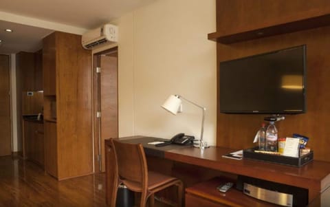 Standard Apartment | Minibar, in-room safe, desk, laptop workspace