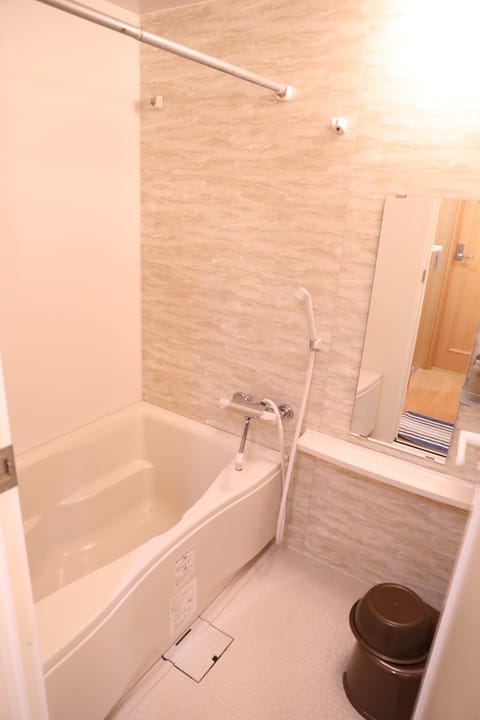 Apartment, Non Smoking (301) | Bathroom | Combined shower/tub, hair dryer, slippers, electronic bidet