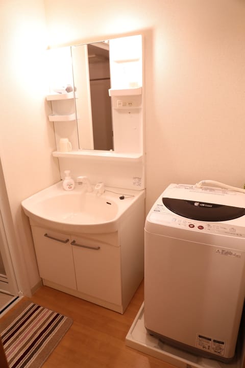 Apartment, Non Smoking (801) | Bathroom | Combined shower/tub, hair dryer, slippers, electronic bidet