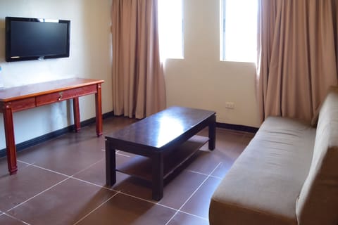 Family Studio | Living area | 32-inch flat-screen TV with cable channels, TV