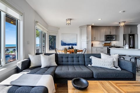 Main level open concept living space with panoramic lake views