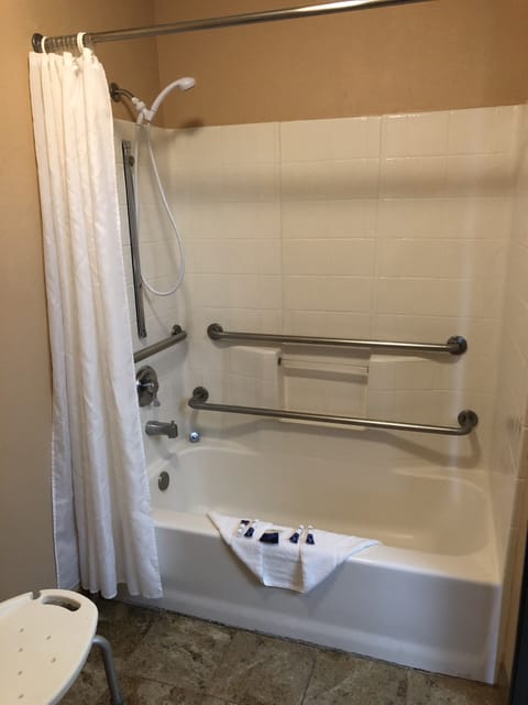 Room, 1 King Bed, Non Smoking | Bathroom | Combined shower/tub, free toiletries, hair dryer, towels