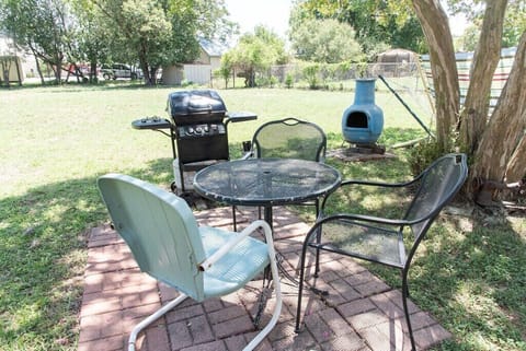 Crepe Myrtle shade outdoor seating and gas grill area