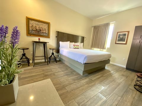 Room, 1 King Bed, Courtyard Area | Individually decorated, individually furnished, iron/ironing board