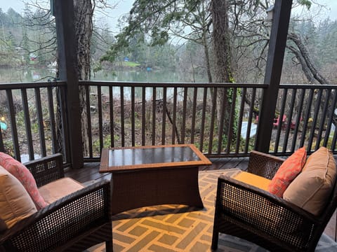Patio seating overlooking natural acreage bird sanctuary and waterfront