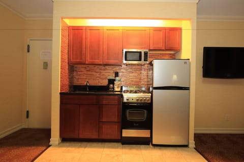 Fridge, microwave, stovetop, coffee/tea maker