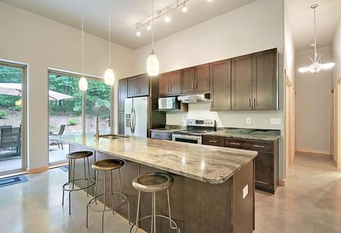 kitchen bar with seating for everyone to gather and socialize