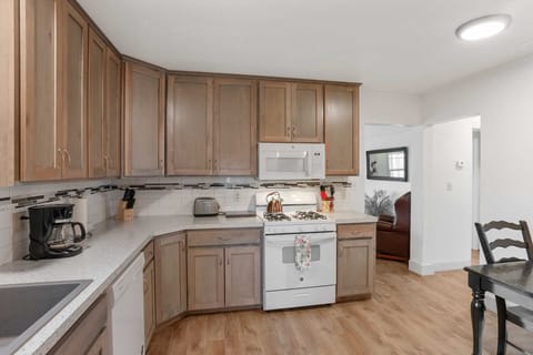 A chef's delight! This fully equipped kitchen features modern appliances, ample storage, and easy access to the dining and living areas