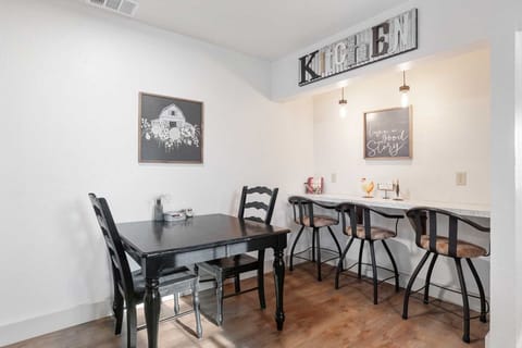 Dine together at the charming kitchen table or enjoy a casual meal at the stylish breakfast bar in this well-appointed space
