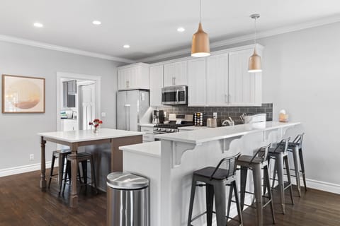 Kitchen- Through the door is the laundry room, back porch,  hot tub and more. 