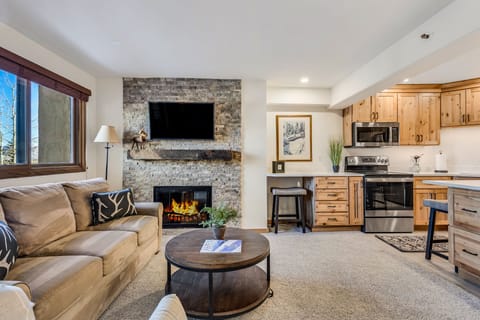 Living room with wood-burning fireplace