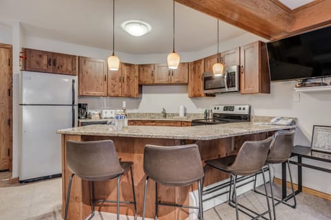 Full kitchen with bar seating