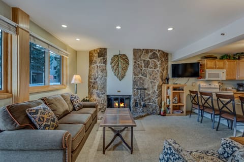 Living room with a wood-burning fireplace