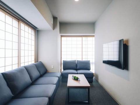 Three-Bedroom Suite | Living area | Smart TV