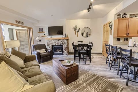 Cozy up by the fire in our charming living room retreat with a Smart TV.