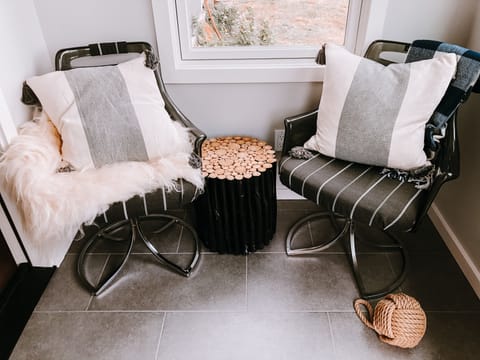 Little enclosed front porch, perfect for a cup of tea on a rainy day.