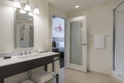 Suite, 1 King Bed | Bathroom | Combined shower/tub, rainfall showerhead, free toiletries, hair dryer