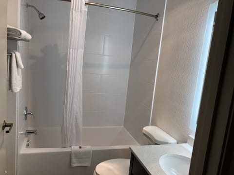 Room, 2 Queen Beds, Smoking | Bathroom | Combined shower/tub, hair dryer, towels