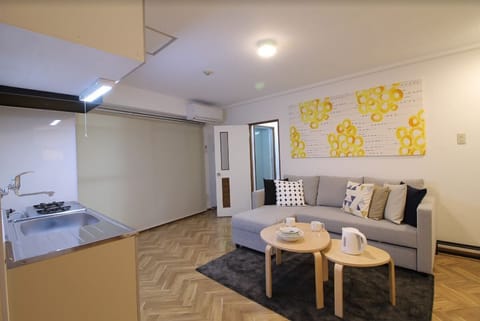 Apartment, 1 Bedroom, Non Smoking (203) | Living area | Flat-screen TV