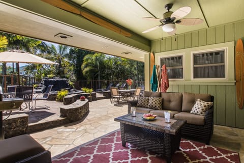Outdoor covered lanai and spacious backyard area.