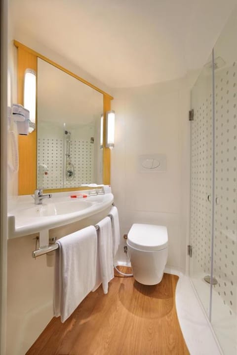 Shower, eco-friendly toiletries, hair dryer, slippers