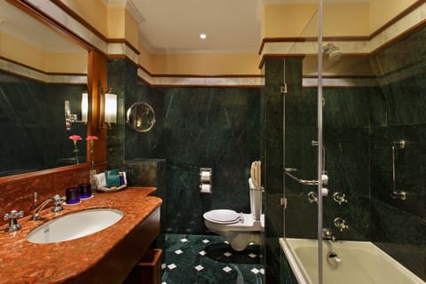 Deluxe Room | Bathroom amenities | Combined shower/tub, deep soaking tub, designer toiletries, hair dryer