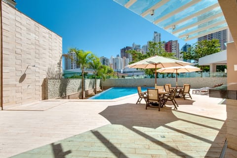 Outdoor pool, pool umbrellas, sun loungers