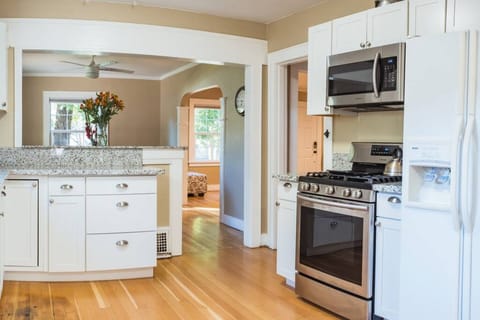 Whip up your favorite meal while chatting with friends in this open kitchen that flows seamlessly to the living room.