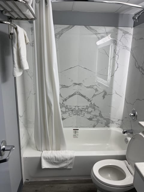 Combined shower/tub, rainfall showerhead, towels, soap