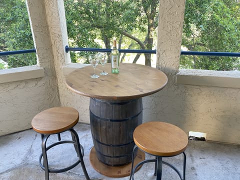 Enjoy a glass of wine, looking out at hill country and quiet side of lake