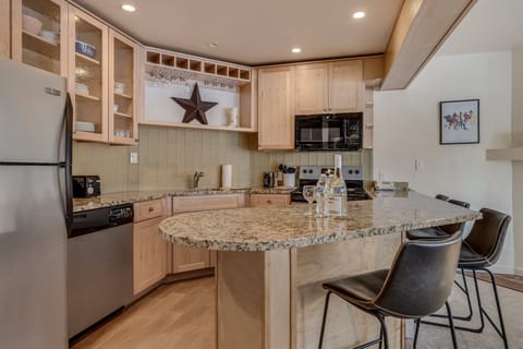 Full kitchen with bar seating