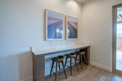 Additional bar seating for 3 (located behind the dining room table)