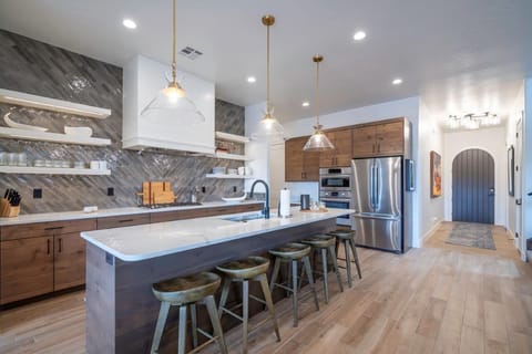 Large kitchen stocked with appliances and utensils for cooking