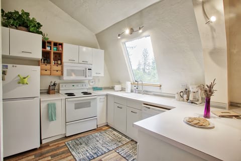 This cozy kitchen is full of light.