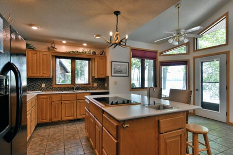 House, Multiple Beds, Jetted Tub (Cheif Lake Lodge) | Private kitchen | Fridge, microwave, oven, stovetop