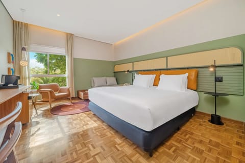 Room, 1 King Bed, Garden View | Minibar, in-room safe, individually decorated, desk