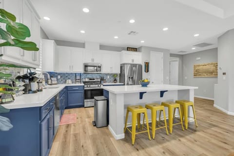Opened concept kitchen with bar stool island seating