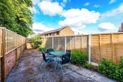 The large private fenced garden with outdoor seating for drinks in the sun.