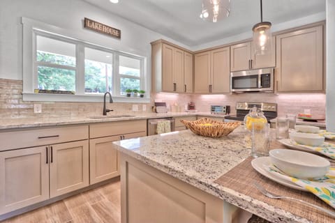 Fully equipped kitchen with stove, oven, microwave, dishwasher, coffee maker, and refrigerator