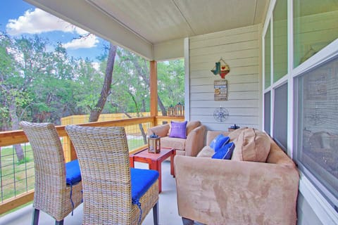 Enjoy time with friends and family in the outdoor seating area with covered awning