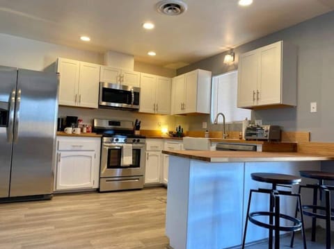 View of kitchen area. Perspective from living room.