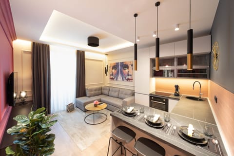 Elite Apartment | Living area | 100-cm Smart TV with satellite channels, TV