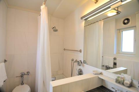 One Bedroom King Suite | Bathroom | Designer toiletries, hair dryer, bathrobes, towels