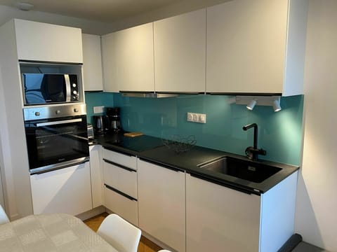 Countertop, Cabinetry, Kitchen Sink, Sink, Property, Tap, Furniture, Kitchen Stove, Kitchen, Kitchen Appliance