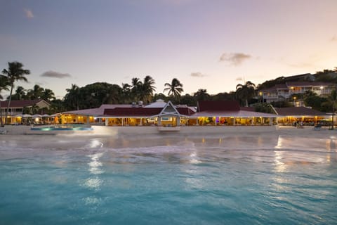 On the beach, white sand, sun loungers, beach umbrellas