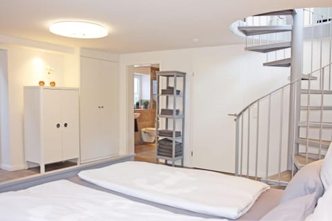 Bright, spacious bedroom with access to the bathroom