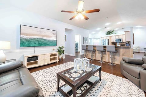 Enjoy our open concept kitchen/family room with 82” SmartTV.