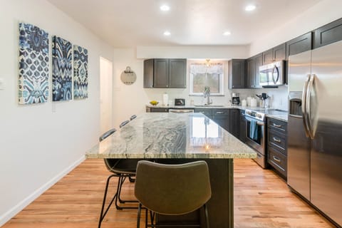 Center Island with Granite Counter-tops and seating for 4.
